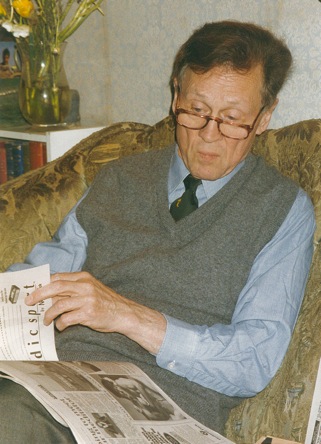 Peter Hopkirk, reading newspaper